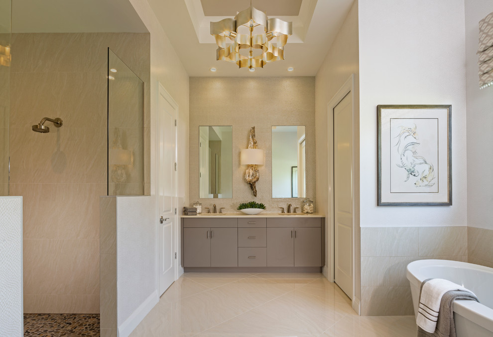Bathroom - transitional gray tile beige floor bathroom idea in Miami with flat-panel cabinets, gray cabinets, white walls, an undermount sink and white countertops