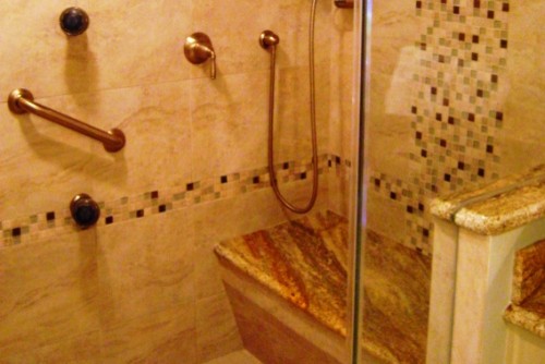 Example of a large classic master marble floor and beige floor bathroom design in New Orleans with furniture-like cabinets, white cabinets, a two-piece toilet, gray walls, an undermount sink, granite countertops and a hinged shower door