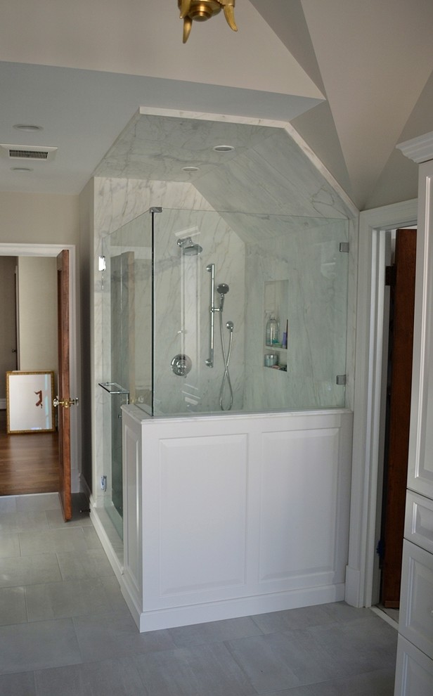 Example of a large classic master ceramic tile bathroom design in St Louis with recessed-panel cabinets, white cabinets, beige walls, an undermount sink and marble countertops