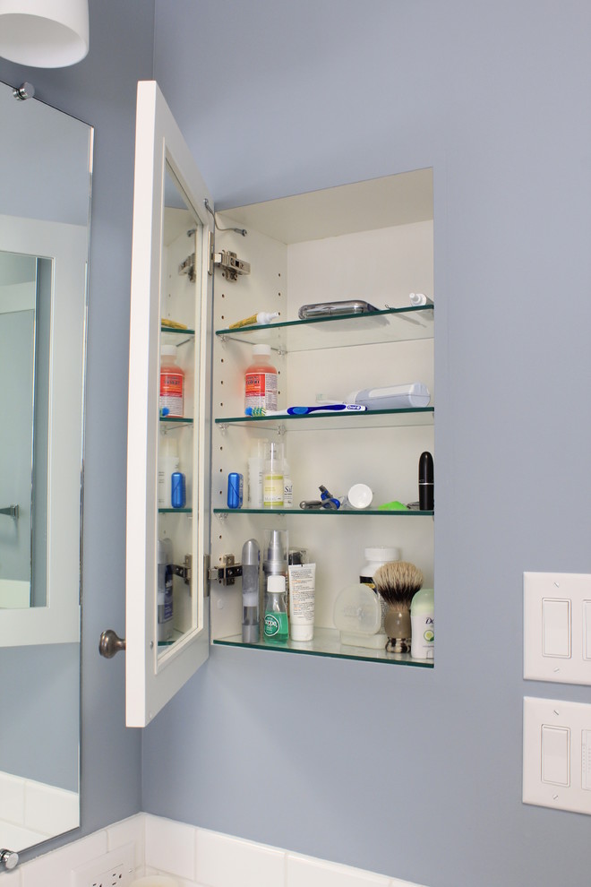 Small elegant master white tile and ceramic tile porcelain tile and gray floor bathroom photo in San Francisco with shaker cabinets, white cabinets, a one-piece toilet, blue walls, an undermount sink, marble countertops, a hinged shower door and white countertops