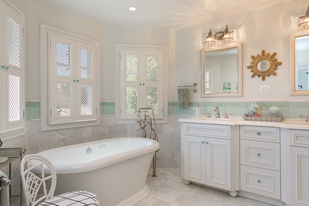 Mid-sized elegant multicolored tile and ceramic tile porcelain tile freestanding bathtub photo in San Diego with an undermount sink, recessed-panel cabinets, white cabinets, granite countertops and white walls