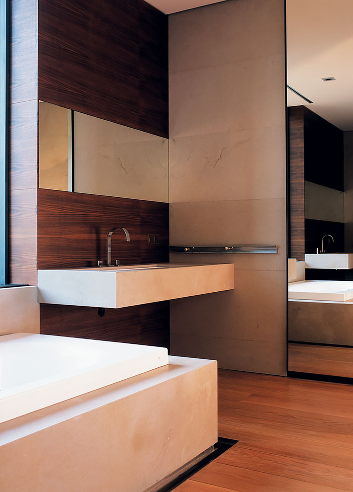 На фото: большая главная ванная комната в стиле модернизм с накладной ванной, коричневой плиткой, паркетным полом среднего тона, врезной раковиной, столешницей из бетона, коричневым полом и коричневой столешницей с