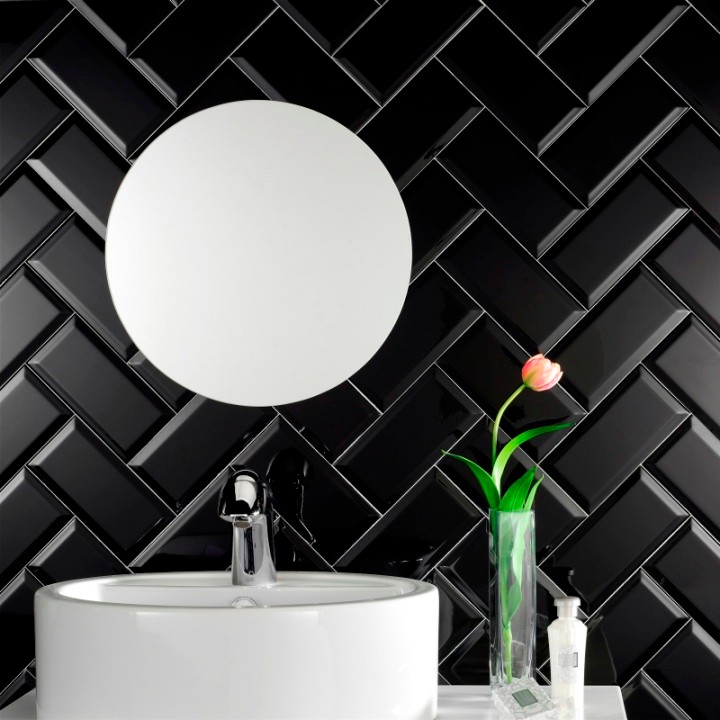 This is an example of a small modern bathroom in Other with black tiles, ceramic tiles and black walls.