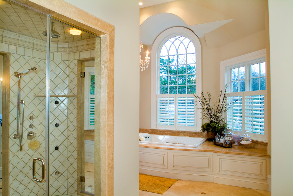 Inspiration for a large transitional master beige tile and ceramic tile ceramic tile doorless shower remodel in Philadelphia with furniture-like cabinets, light wood cabinets, granite countertops, a hot tub and yellow walls