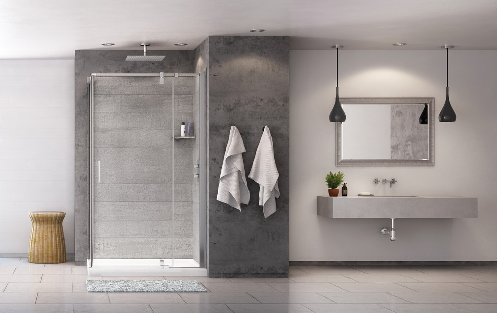 Cette photo montre une salle de bain industrielle avec une douche d'angle, un carrelage gris, des dalles de pierre et un mur gris.