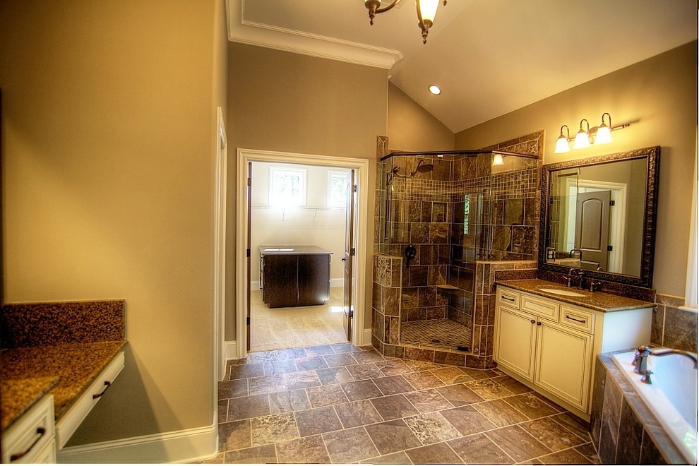 Example of a large arts and crafts master brown tile and ceramic tile ceramic tile bathroom design in Atlanta with an undermount sink, recessed-panel cabinets, beige cabinets, marble countertops and a one-piece toilet