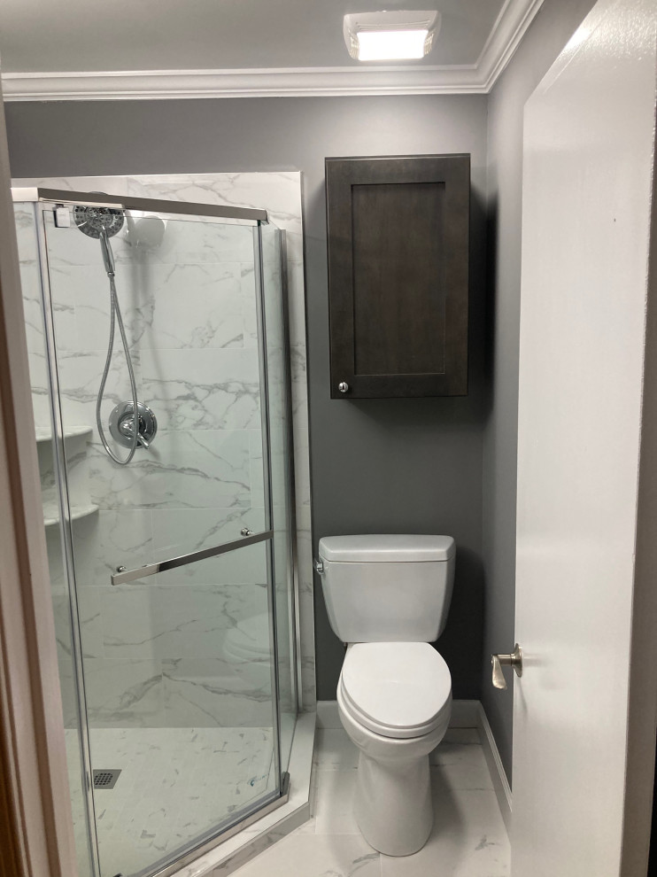 Example of a small minimalist kids' white tile and porcelain tile porcelain tile, white floor and single-sink corner shower design in DC Metro with shaker cabinets, gray cabinets, a two-piece toilet, gray walls, an undermount sink, quartzite countertops, a hinged shower door, white countertops and a built-in vanity
