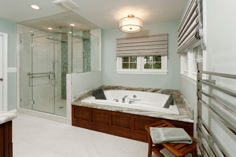 Inspiration for a mid-sized transitional master gray tile and porcelain tile porcelain tile bathroom remodel in DC Metro with shaker cabinets, medium tone wood cabinets, a two-piece toilet, blue walls, an undermount sink and granite countertops