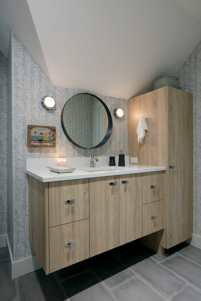 Bathroom - mid-sized traditional ceramic tile and gray floor bathroom idea in Other with flat-panel cabinets, light wood cabinets, multicolored walls, an undermount sink, quartz countertops and white countertops