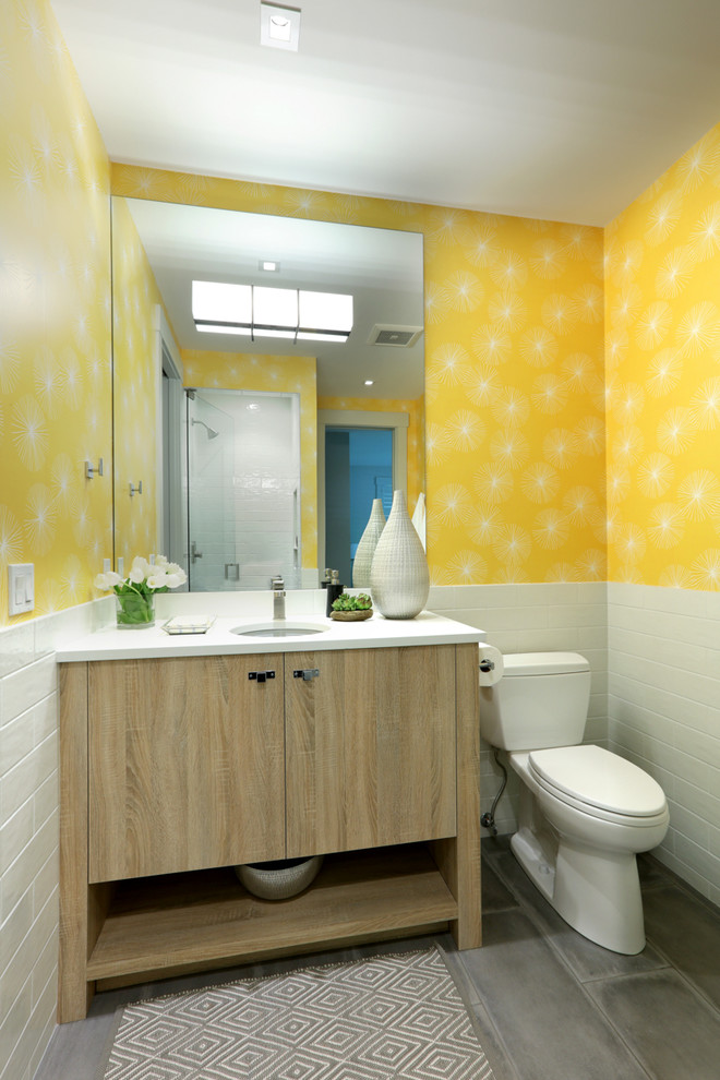 This is an example of a medium sized classic shower room bathroom in Other with flat-panel cabinets, light wood cabinets, an alcove shower, white tiles, ceramic tiles, ceramic flooring, a submerged sink, brown floors, a hinged door, a two-piece toilet, white worktops, engineered stone worktops and yellow walls.