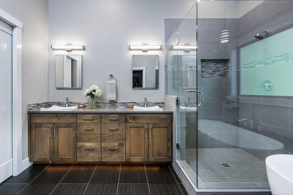 Inspiration for a large transitional master multicolored tile and porcelain tile porcelain tile bathroom remodel in Portland with shaker cabinets, medium tone wood cabinets, gray walls, a vessel sink, quartz countertops and a hinged shower door