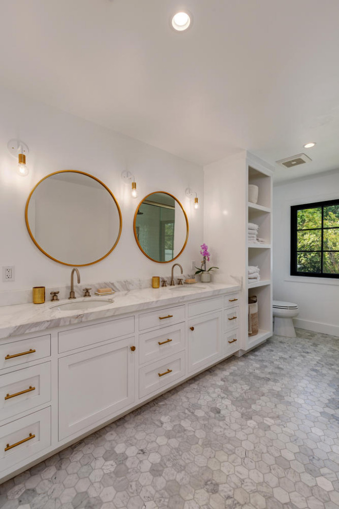 Large transitional kids' gray tile and porcelain tile marble floor, gray floor and double-sink bathroom photo in Los Angeles with shaker cabinets, medium tone wood cabinets, an undermount sink, marble countertops, a hinged shower door, gray countertops and a built-in vanity