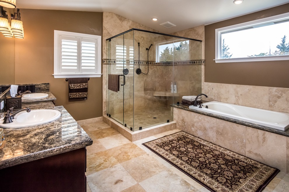 Bathroom - large traditional master beige tile marble floor bathroom idea in San Francisco with a drop-in sink, dark wood cabinets, granite countertops, a one-piece toilet and brown walls