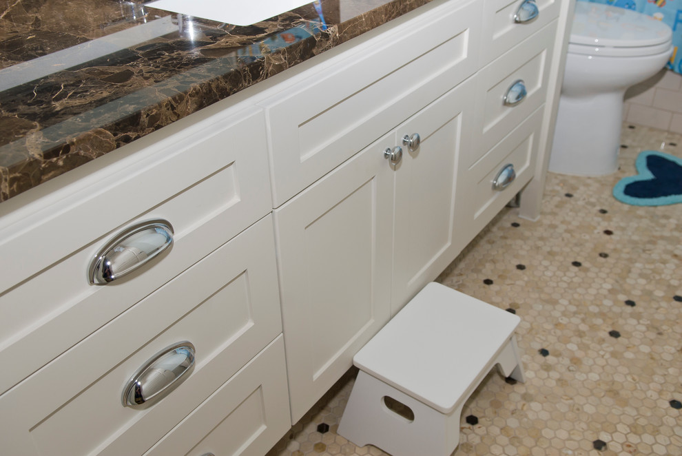 Design ideas for a traditional family bathroom in Dallas with shaker cabinets, beige cabinets, a submerged bath, a shower/bath combination, a two-piece toilet, beige tiles, ceramic tiles, blue walls, ceramic flooring, a submerged sink and marble worktops.