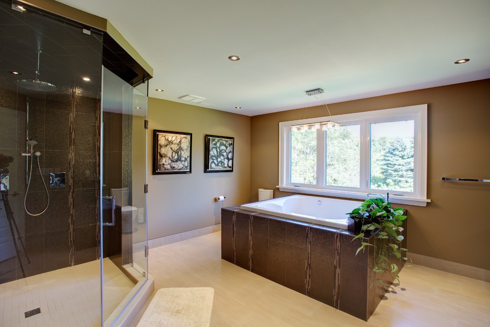 Photo of a large traditional bathroom in Toronto with a hot tub and a walk-in shower.