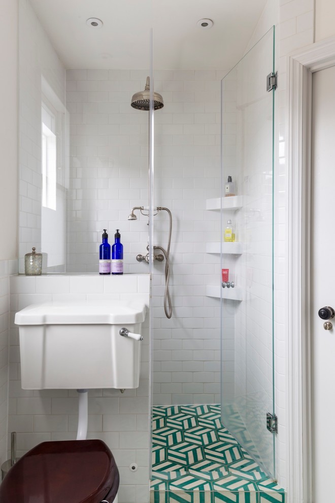 На фото: детская ванная комната среднего размера: освещение в стиле неоклассика (современная классика) с накладной ванной, открытым душем, раздельным унитазом, синей плиткой, белой плиткой, цементной плиткой, белыми стенами, полом из керамической плитки и душем с распашными дверями
