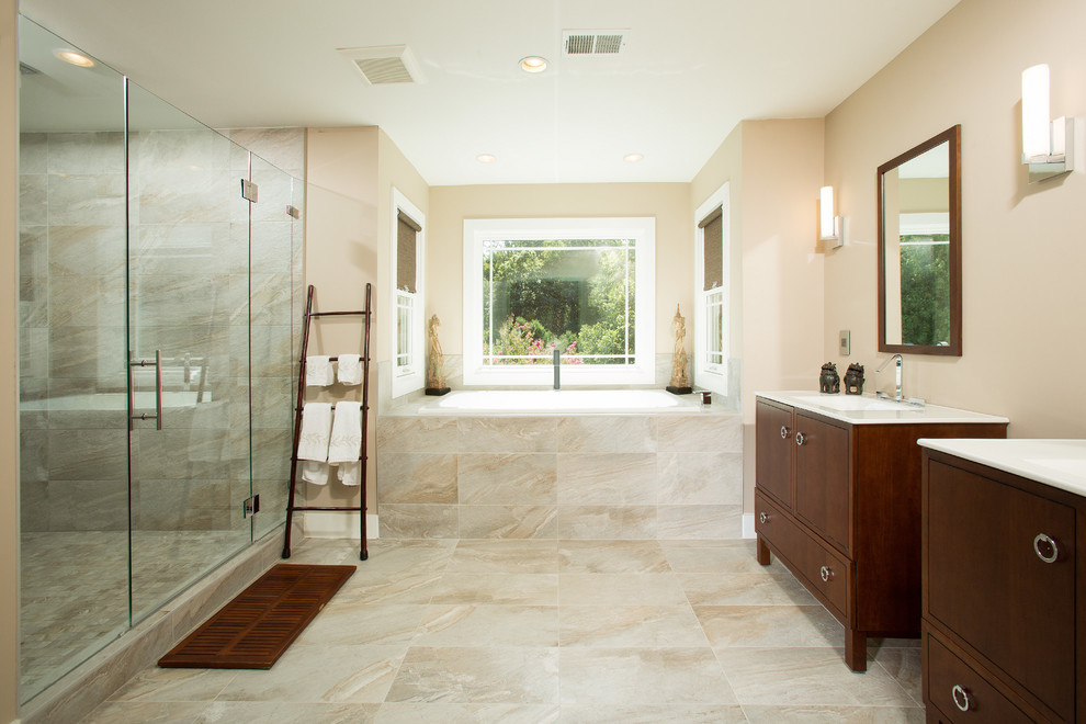 This is an example of a large classic ensuite bathroom in DC Metro with dark wood cabinets, beige tiles, ceramic tiles, beige walls, ceramic flooring, beige floors, a hinged door, a submerged bath and flat-panel cabinets.