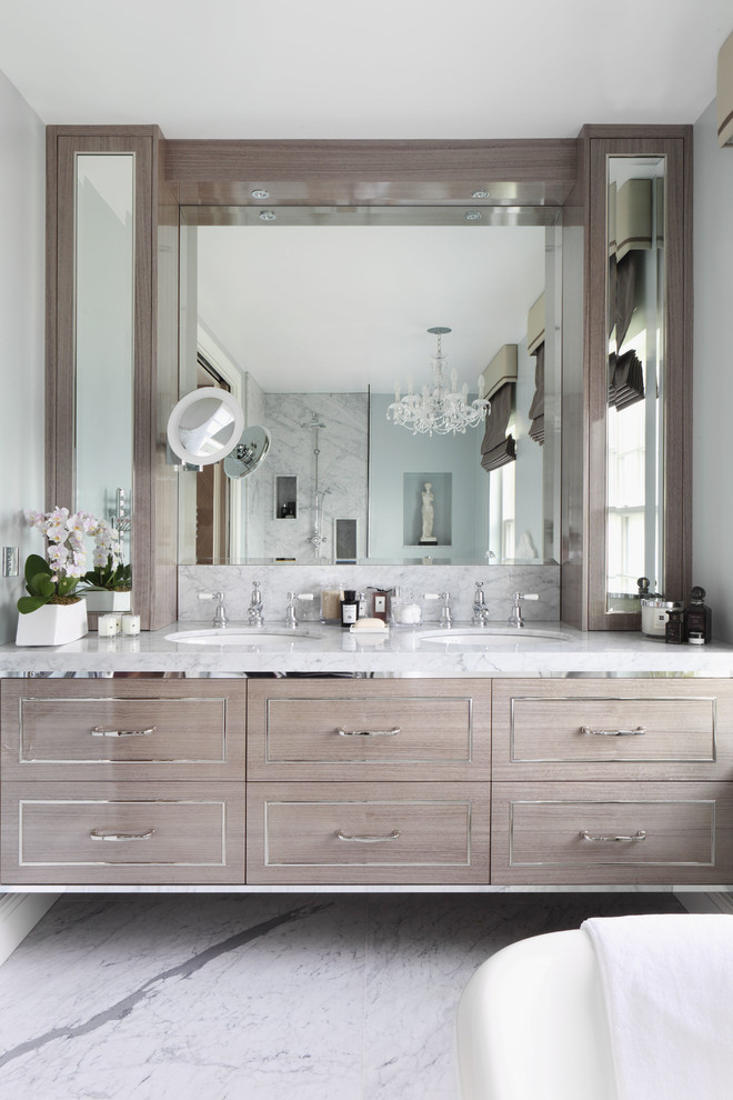 Inspiration for a large traditional bathroom in London with grey cabinets and dark hardwood flooring.