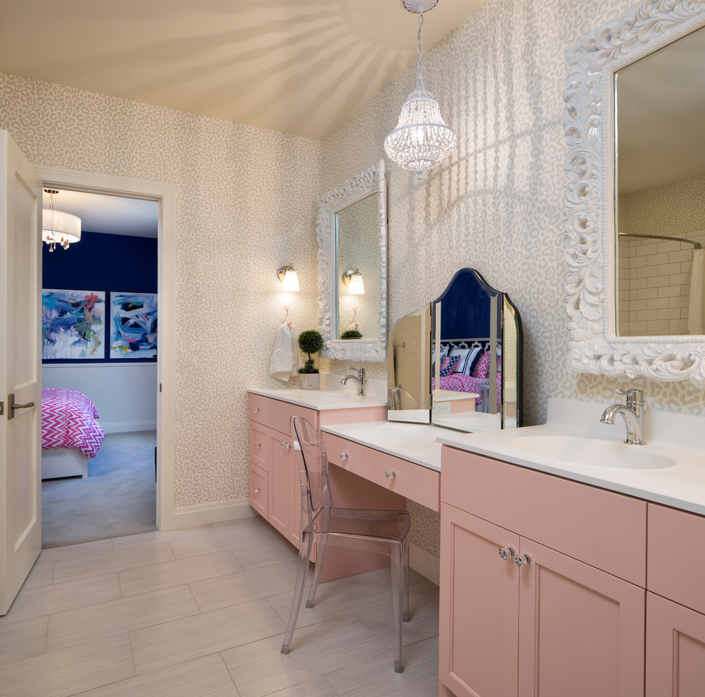 Photo of a classic grey and pink bathroom in Minneapolis with recessed-panel cabinets, beige walls and an integrated sink.