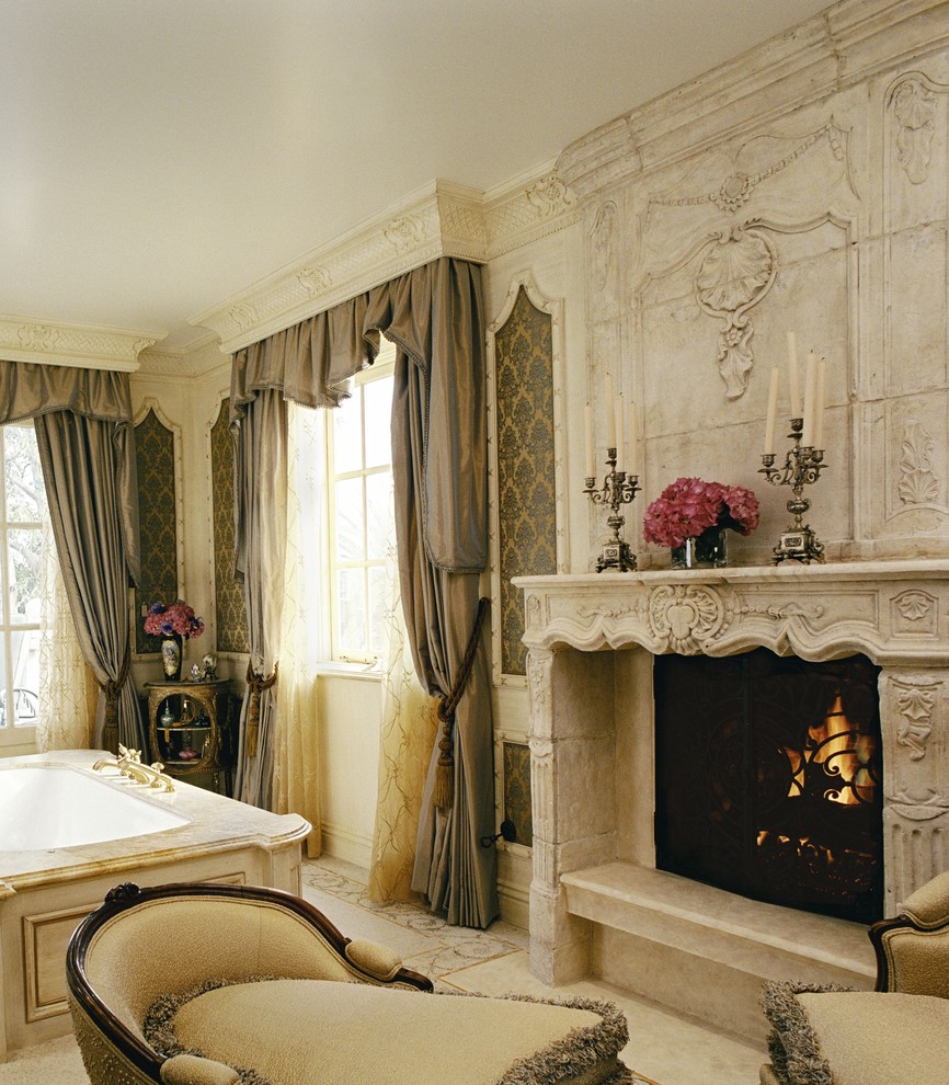 Example of an ornate bathroom design in Los Angeles with an undermount tub