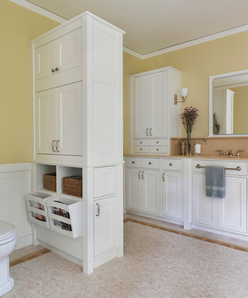 Inspiration for a classic bathroom in Boston with shaker cabinets, white cabinets, yellow walls and beige floors.