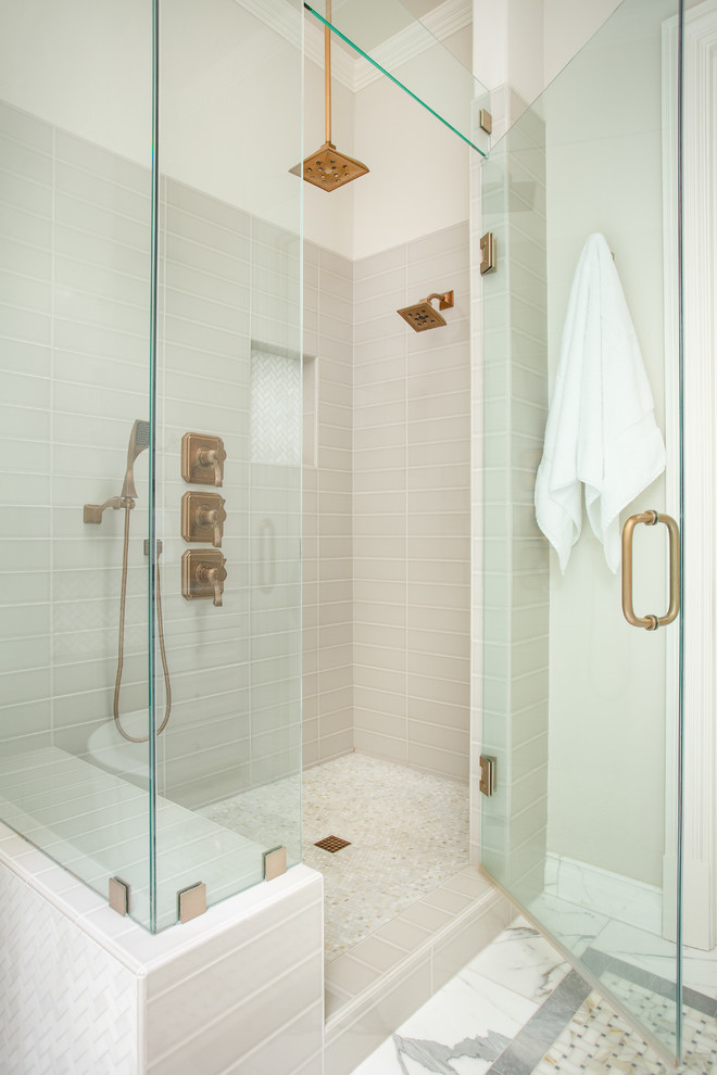 Bathroom - large traditional master gray tile and ceramic tile marble floor and multicolored floor bathroom idea in Dallas with recessed-panel cabinets, white cabinets, a two-piece toilet, beige walls, a vessel sink, quartz countertops, a hinged shower door and white countertops