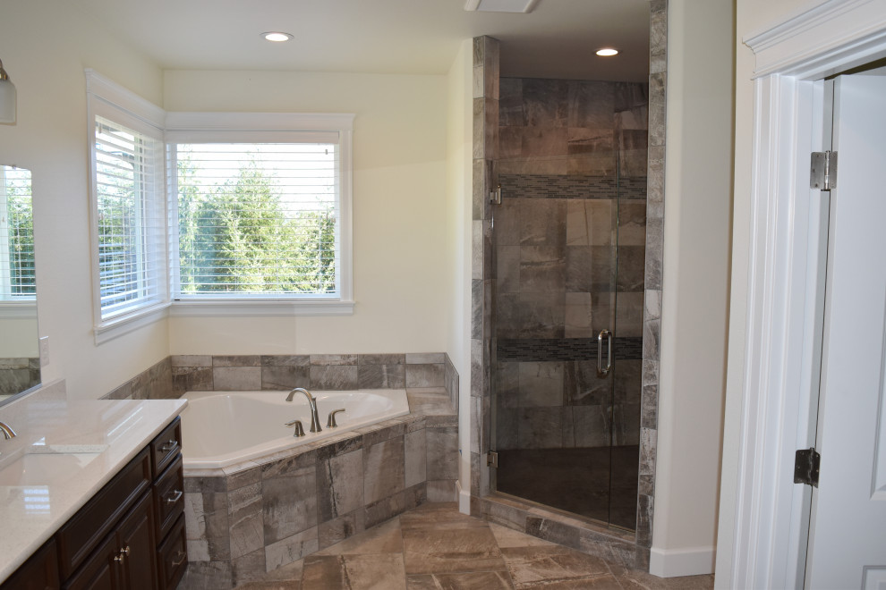 Mid-sized elegant master gray tile and porcelain tile porcelain tile, gray floor and double-sink bathroom photo in Portland with raised-panel cabinets, dark wood cabinets, a two-piece toilet, white walls, an undermount sink, quartzite countertops, a hinged shower door, white countertops and a built-in vanity