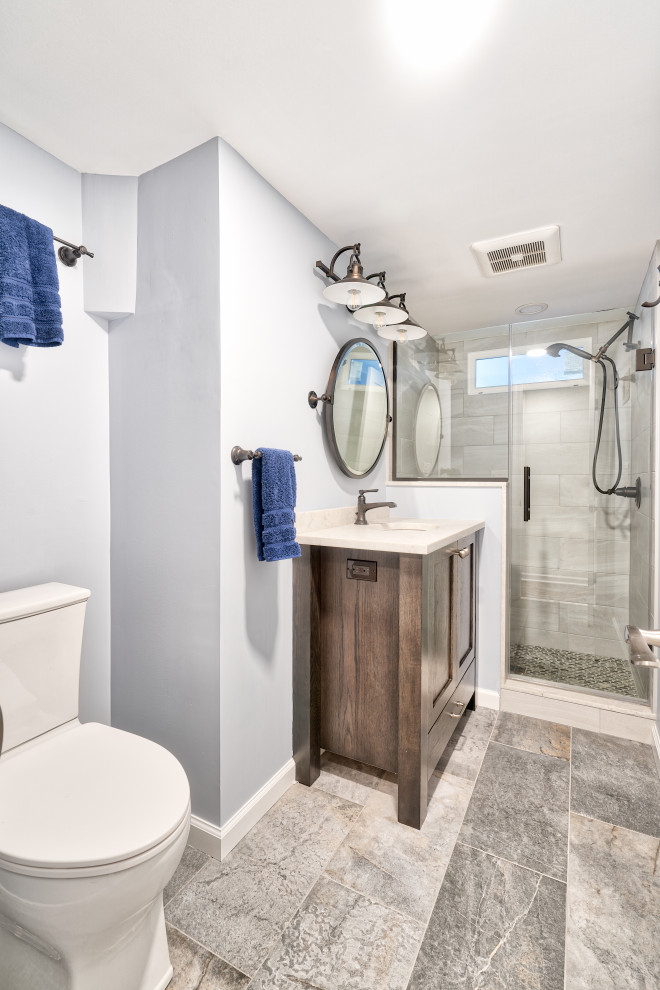 Example of a small farmhouse gray tile gray floor and single-sink bathroom design in New York with recessed-panel cabinets, medium tone wood cabinets, a two-piece toilet, an undermount sink, copper countertops, a hinged shower door, white countertops, a niche and a freestanding vanity