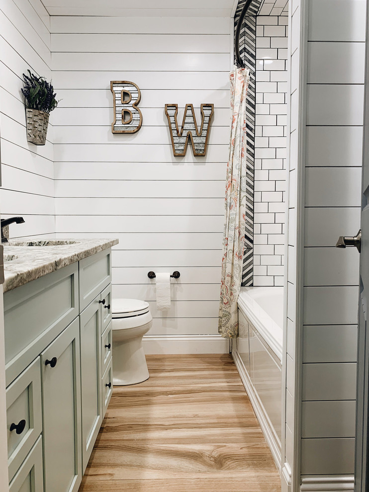 Bathroom - mid-sized cottage kids' white tile and subway tile ceramic tile and beige floor bathroom idea in Other with shaker cabinets, green cabinets, a hot tub, a one-piece toilet, white walls, an undermount sink, granite countertops and gray countertops