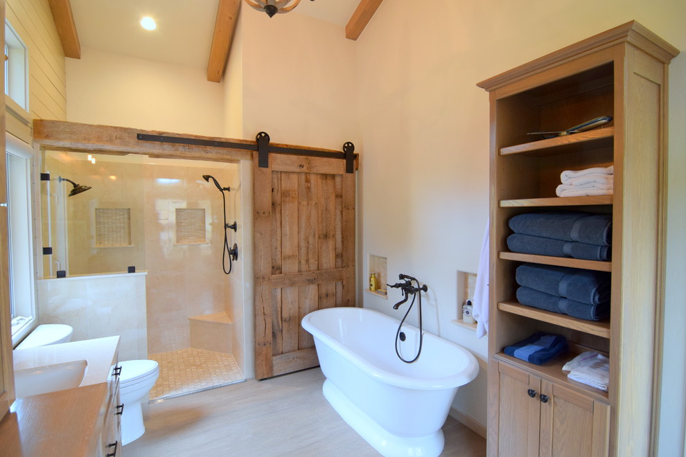 Bathroom - large farmhouse master beige tile and porcelain tile ceramic tile bathroom idea in San Luis Obispo with shaker cabinets, medium tone wood cabinets, a one-piece toilet, beige walls, an undermount sink and marble countertops