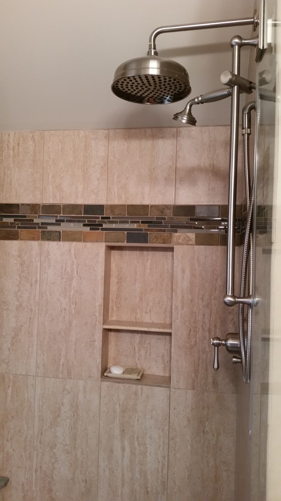 Design ideas for a medium sized country bathroom in Milwaukee with freestanding cabinets, medium wood cabinets, a built-in shower, multi-coloured tiles, stone tiles and engineered stone worktops.