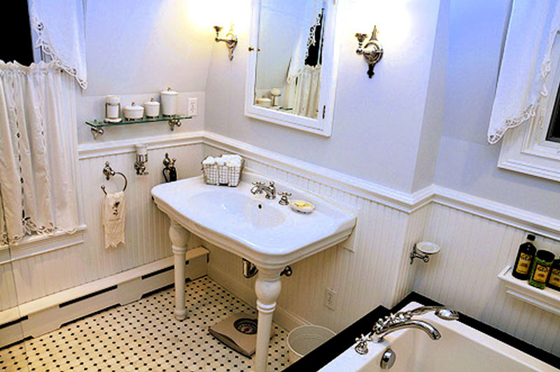 Mid-sized country master multicolored tile mosaic tile floor bathroom photo in New York with a pedestal sink, a one-piece toilet and white walls