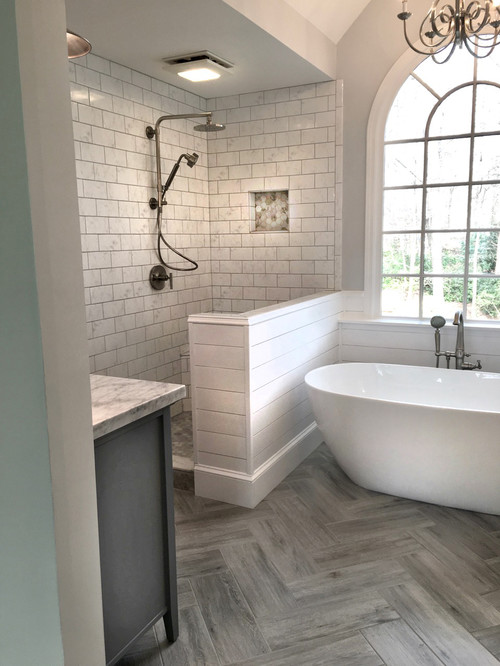 mid-sized farmhouse master white tile and ceramic tile ceramic tile and gray floor bathroom remodel in Atlanta with shaker cabinets, gray cabinets, a two-piece toilet, gray walls, an undermount sink, marble countertops and a hinged shower door
