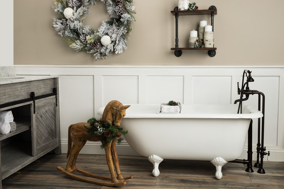Claw-foot bathtub - mid-sized cottage master claw-foot bathtub idea in Other with furniture-like cabinets, gray cabinets, beige walls, an integrated sink, granite countertops and white countertops