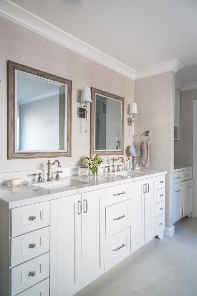 Example of a french country master ceramic tile and gray floor freestanding bathtub design in Houston with shaker cabinets, white cabinets, beige walls, an undermount sink, granite countertops and gray countertops