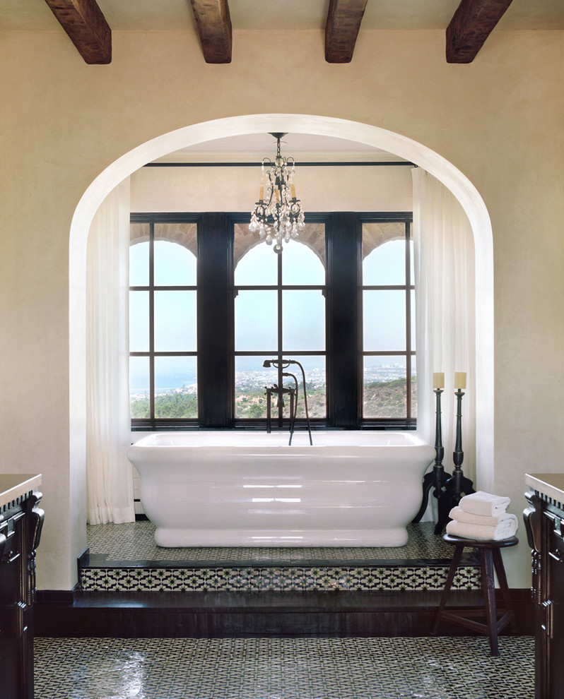 This is an example of a mediterranean bathroom in Los Angeles with a freestanding bath.