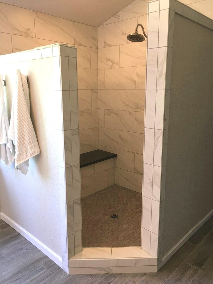 Inspiration for a large country ensuite bathroom in Sacramento with shaker cabinets, white cabinets, an alcove shower, white tiles, porcelain tiles, white walls, porcelain flooring, a trough sink, engineered stone worktops, grey floors, an open shower and black worktops.
