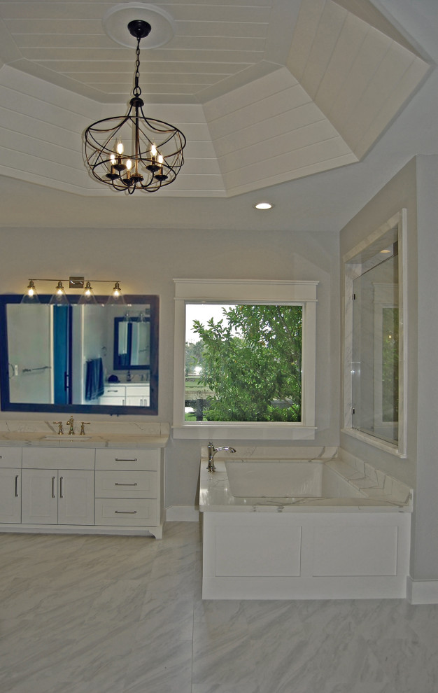 Inspiration for a medium sized country ensuite bathroom in Houston with shaker cabinets, white cabinets, a submerged bath, a built-in shower, a two-piece toilet, white tiles, porcelain tiles, grey walls, porcelain flooring, a submerged sink, engineered stone worktops, white floors, a hinged door and white worktops.