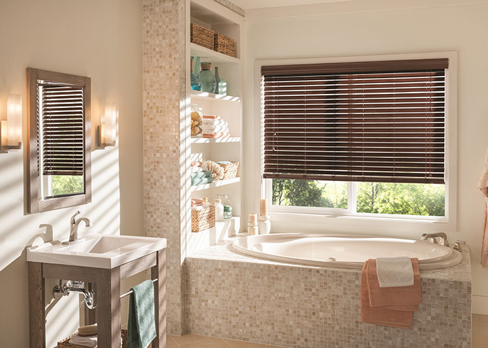 Mid-sized elegant master beige tile and ceramic tile ceramic tile drop-in bathtub photo in Sacramento with open cabinets, medium tone wood cabinets, white walls, a drop-in sink and solid surface countertops