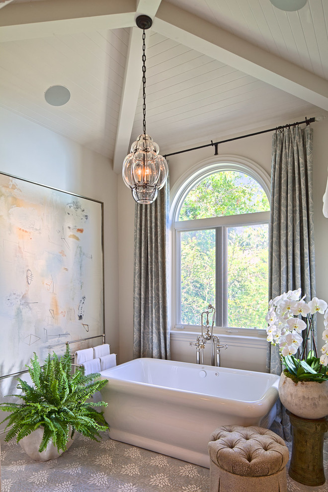 Photo of a classic bathroom in Los Angeles with a freestanding bath, grey walls, mosaic tile flooring and grey floors.