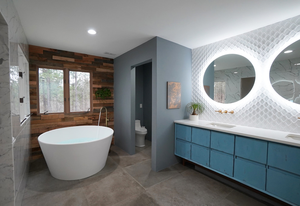 Example of a large danish master white tile and porcelain tile porcelain tile and gray floor bathroom design in Atlanta with flat-panel cabinets, blue cabinets, a one-piece toilet, blue walls, an undermount sink, quartz countertops, a hinged shower door and white countertops