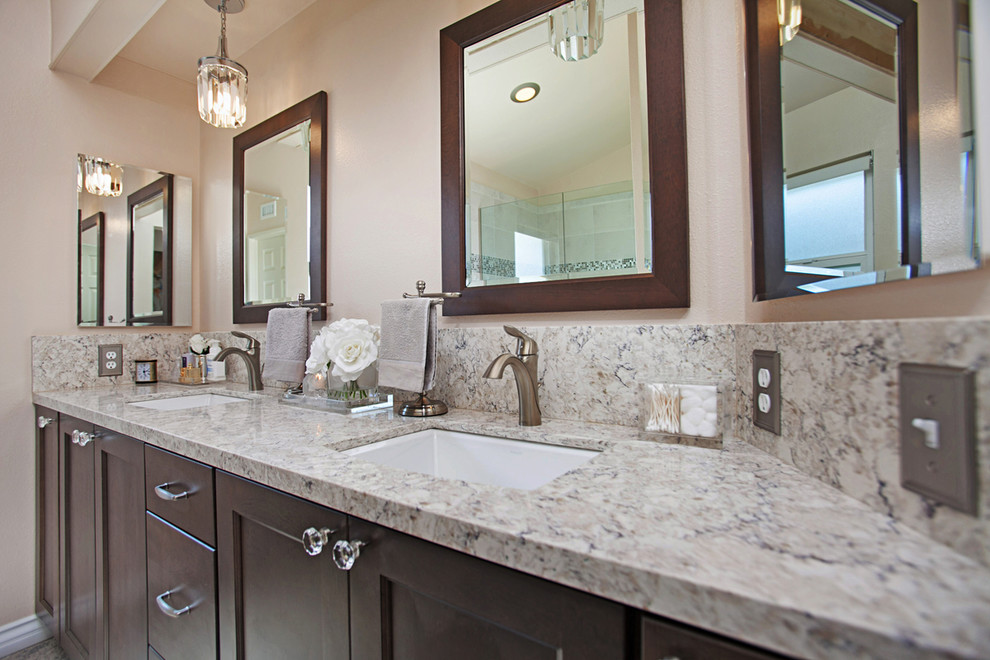 Transitional master multicolored tile and ceramic tile ceramic tile and multicolored floor bathroom photo in San Diego with pink walls, shaker cabinets, brown cabinets, an undermount sink, quartz countertops and a hinged shower door