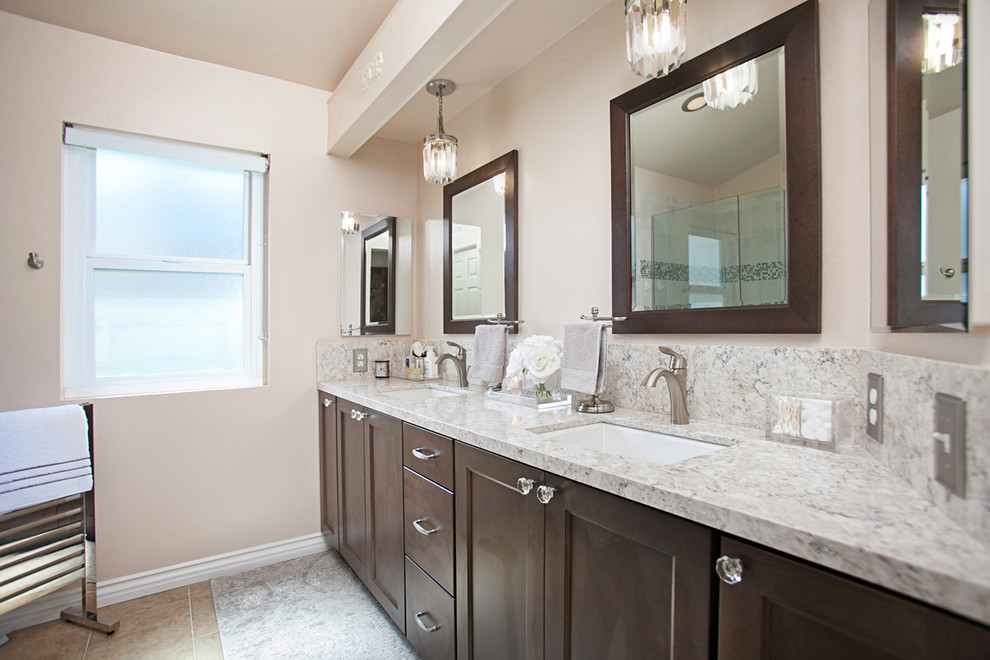 Example of a transitional master multicolored tile and ceramic tile ceramic tile and multicolored floor bathroom design in San Diego with pink walls, shaker cabinets, brown cabinets, an undermount sink, quartz countertops and a hinged shower door
