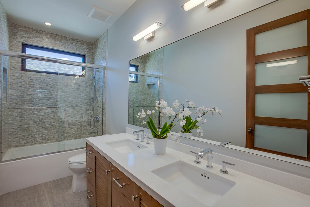 Example of a mid-sized trendy 3/4 multicolored tile and matchstick tile vinyl floor bathroom design in Los Angeles with shaker cabinets, dark wood cabinets, beige walls, an undermount sink and quartz countertops