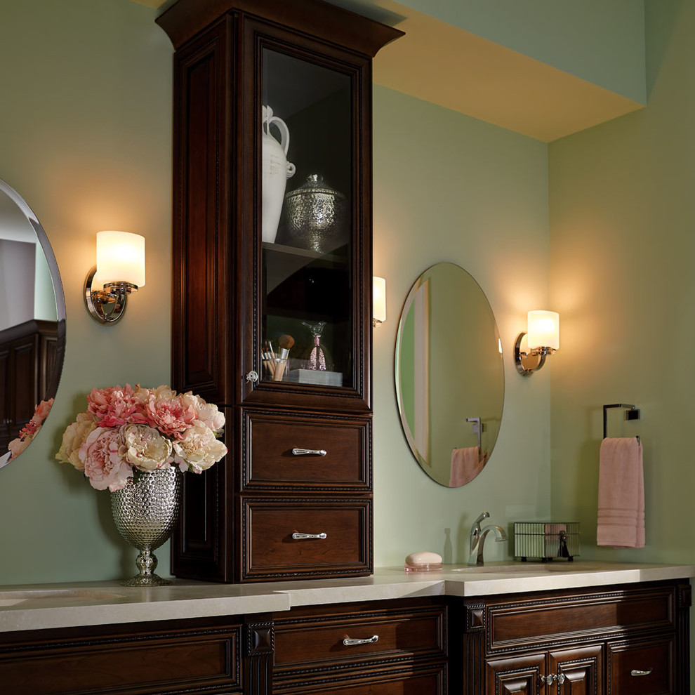 Inspiration for an expansive classic ensuite bathroom in Other with raised-panel cabinets, dark wood cabinets, an alcove bath, green walls, a submerged sink, beige floors and a hinged door.