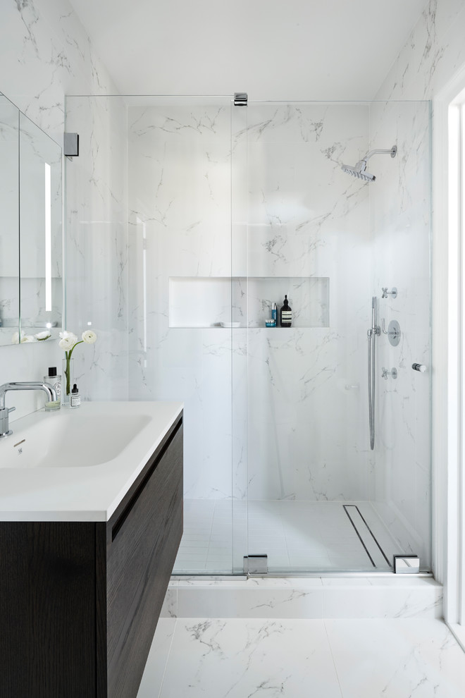 Doorless shower - mid-sized modern master black and white tile and porcelain tile porcelain tile doorless shower idea in New York with furniture-like cabinets, gray cabinets, a one-piece toilet, white walls and a wall-mount sink
