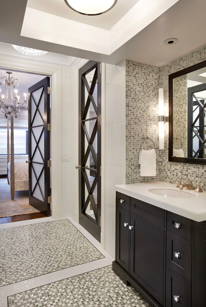 Inspiration for a transitional master multicolored tile and mosaic tile mosaic tile floor bathroom remodel in New York with an undermount sink, recessed-panel cabinets, dark wood cabinets, marble countertops and white walls