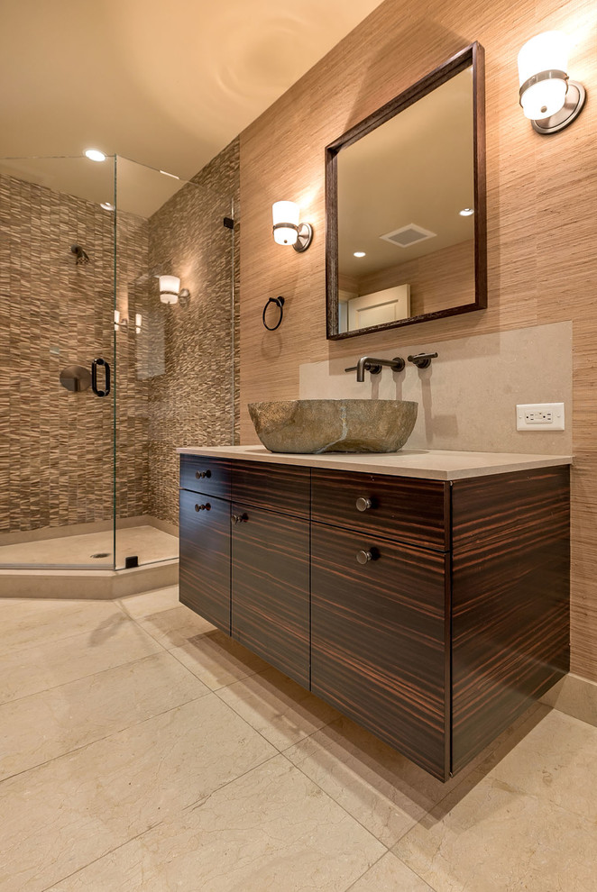 Example of a mid-sized eclectic 3/4 brown tile and stone tile travertine floor corner shower design in San Francisco with a vessel sink, flat-panel cabinets, dark wood cabinets, limestone countertops, a two-piece toilet and brown walls