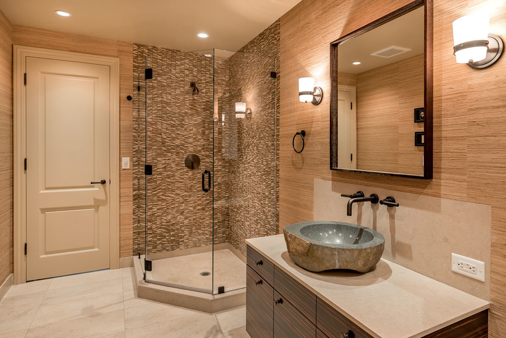 Corner shower - mid-sized eclectic 3/4 brown tile and stone tile limestone floor corner shower idea in San Francisco with a vessel sink, flat-panel cabinets, dark wood cabinets, limestone countertops, a two-piece toilet and brown walls