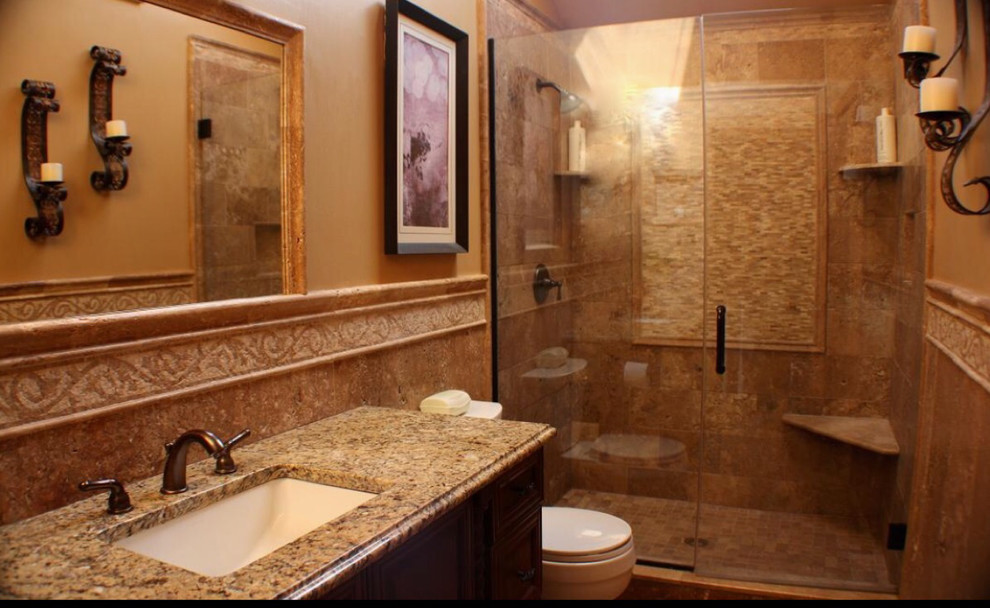 Photo of a medium sized mediterranean shower room bathroom in New York with recessed-panel cabinets, dark wood cabinets, an alcove shower, a two-piece toilet, ceramic tiles, beige walls, a submerged sink, granite worktops, beige floors and a hinged door.